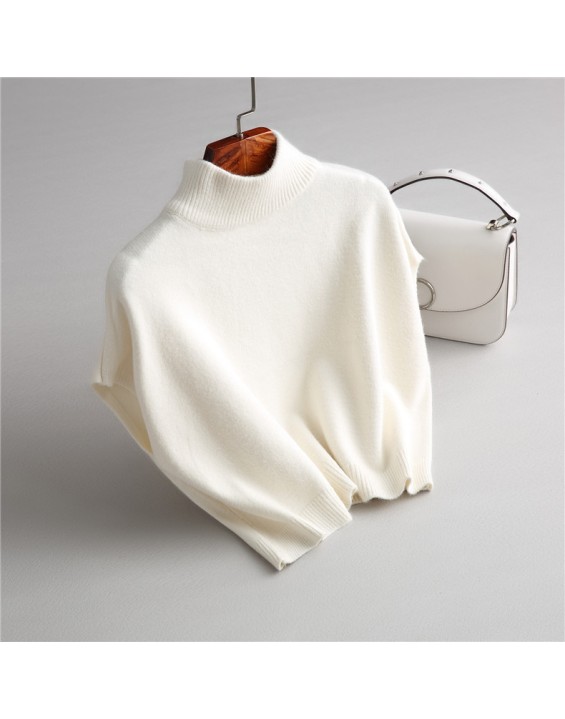 Wearing a low necked small stature with a high necked knitted pullover