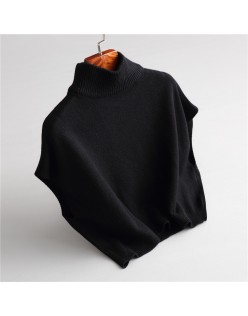 Wearing a low necked small stature with a high necked knitted pullover